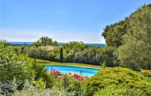 a swimming pool in the middle of a garden at Gorgeous Home In Montaren Et St Mediers in Labaume