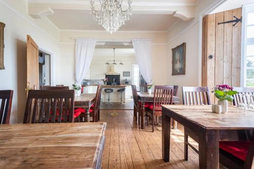 a dining room with a dining table and chairs at St Annes House in Plymouth