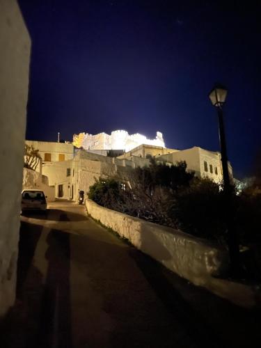 a building with a street light in front of it at Patmos Horizon in Patmos