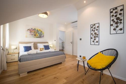 Postel nebo postele na pokoji v ubytování Heritage Villa Unique