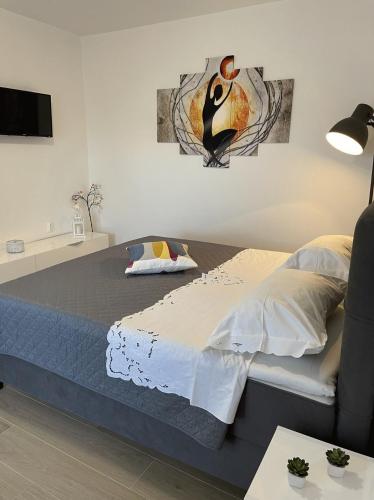 a bedroom with a bed and a tv at Apartment Meri in Korčula