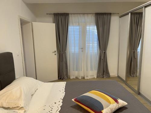 a bedroom with a bed and a large mirror at Apartment Meri in Korčula