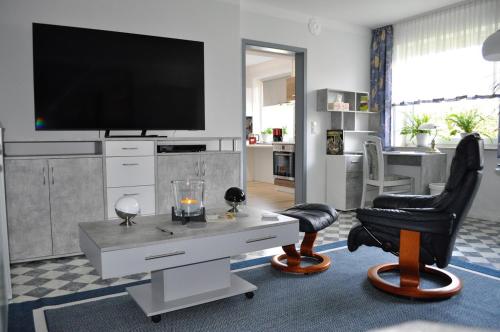 Televisyen dan/atau pusat hiburan di Ferienwohnung Südpark