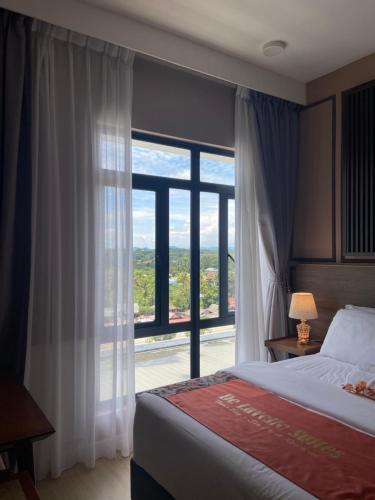 Letto o letti in una camera di De Lavelle Suites @ Timur Bay SeaFront Residence