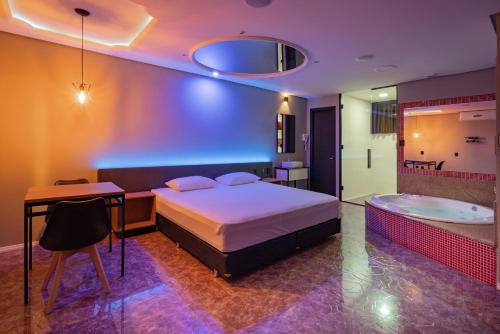 Ένα ή περισσότερα κρεβάτια σε δωμάτιο στο Drops Motel Vale dos Sinos
