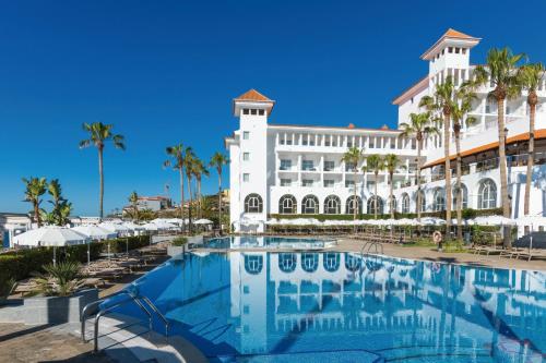 a view of the resort from the pool at Hotel Riu Madeira - All Inclusive in Caniço