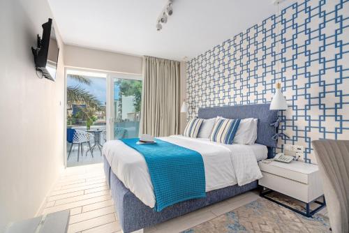 Ένα ή περισσότερα κρεβάτια σε δωμάτιο στο Maison 66, Riviera Hotels