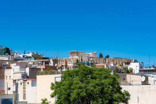 a view of the acropolis from the roofs of buildings at Pnyka Apartment 3 in Athens