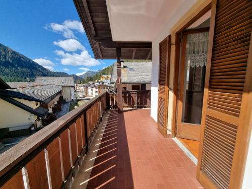 a balcony of a house with a view of the mountains at Solaia in Mazzin