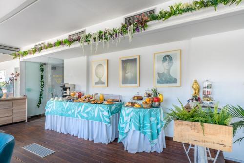 a table with food on it in a room at Maison 66, Riviera Hotels in Athens