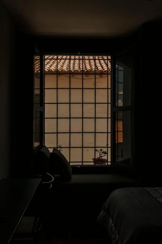 Ein Bett oder Betten in einem Zimmer der Unterkunft Kokoa Hotel Cusco