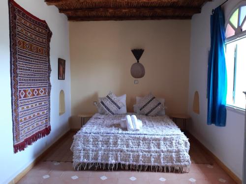 Una cama o camas en una habitación de Riad Douar Des Oliviers