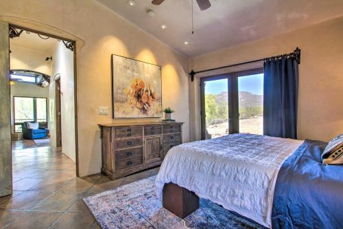 a bedroom with a bed and a large window at Unique Phoenix Abode with 2-Tier Patio and Grills in Anthem