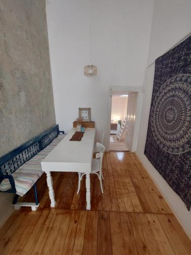 a living room with a white table and a rug at KEKA - apartment in hart of Vrsac in Vršac