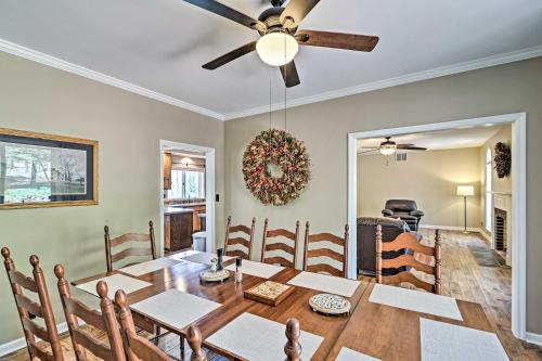 a dining room with a table and a ceiling fan at Family-Friendly Terra Alta Home with Lake View! in Terra Alta