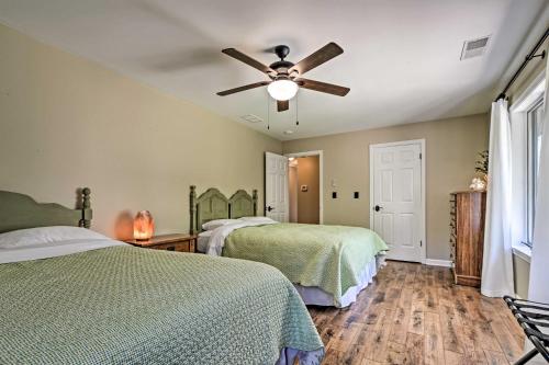 a bedroom with two beds and a ceiling fan at Family-Friendly Terra Alta Home with Lake View! in Terra Alta