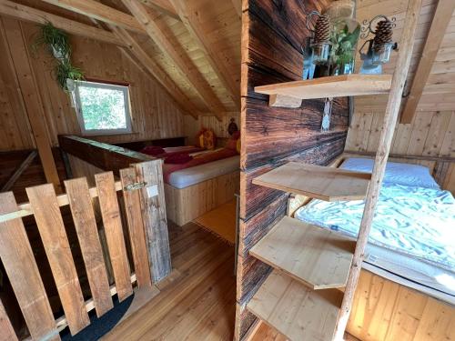 a bedroom and a bunk bed in a cabin at Troadkasten Hollnhof, bezaubernder Panoramablick in Donnersbach