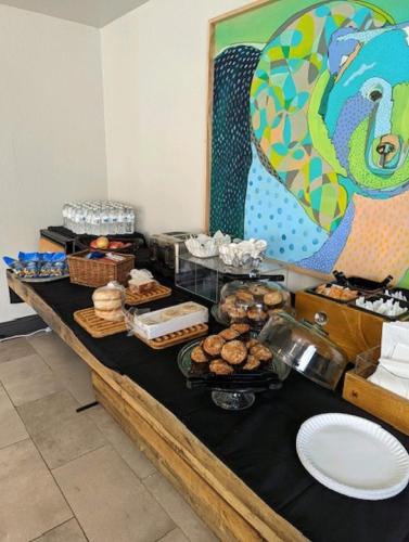 a buffet with a black table with food on it at Hotel Becket, BW Signature Collection in South Lake Tahoe
