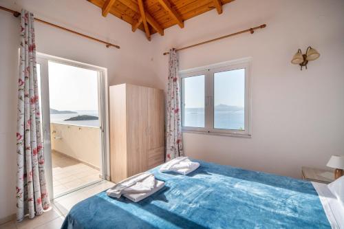 Postel nebo postele na pokoji v ubytování Manos Apartments