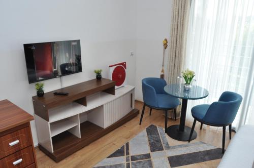 Μια τηλεόραση ή/και κέντρο ψυχαγωγίας στο Hôtel Sky blue Mada