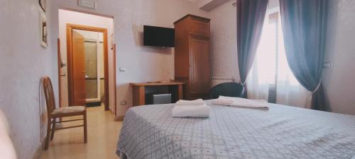 Postel nebo postele na pokoji v ubytování Affittacamere Stranamore