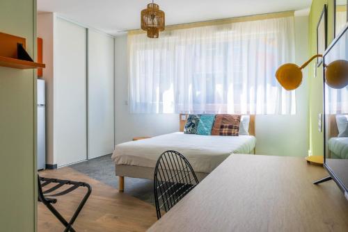 Postel nebo postele na pokoji v ubytování Kabane Montpellier