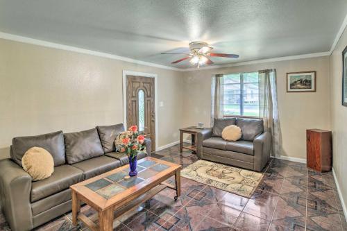 a living room with two couches and a table at Gulf Coast Home Less Than 2 Mi to Parks and Museums! in Orange