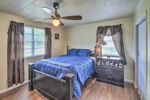a bedroom with a bed and a ceiling fan at Gulf Coast Home Less Than 2 Mi to Parks and Museums! in Orange