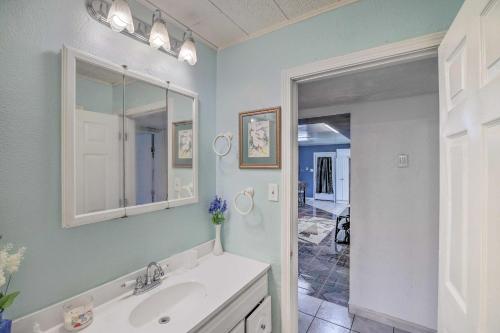 a bathroom with a sink and a mirror at Gulf Coast Home Less Than 2 Mi to Parks and Museums! in Orange