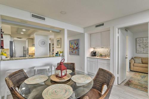 a kitchen and dining room with a table and chairs at Port Aransas Condo Community Perks, Walk to Beach in Port Aransas
