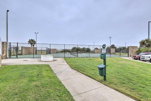 a parking lot with a tennis court in the background at Port Aransas Condo Community Perks, Walk to Beach in Port Aransas