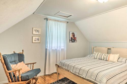 a bedroom with a bed and a chair and a window at Fragola House - Family-Friendly Getaway! in Clifton Heights