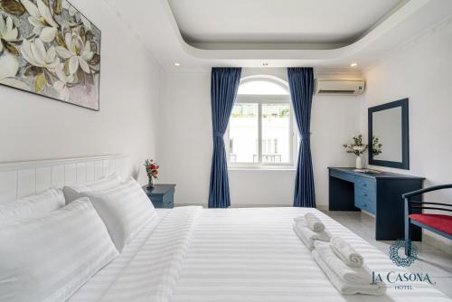 Giường trong phòng chung tại La Casona Hotel