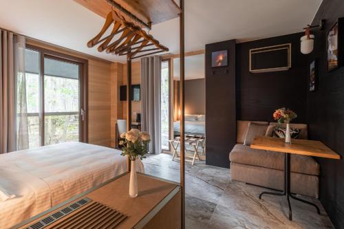 a bedroom with a bed and a desk and a couch at Locanda Milia Etna in Ragalna