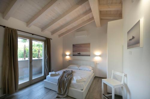 En eller flere senger på et rom på Campeggio Conca D'Oro