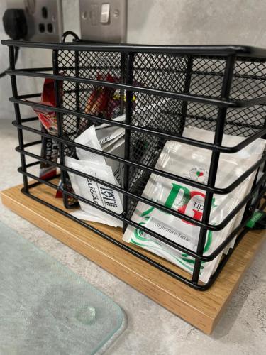 a black wire shelf with some items on it at The Store by Caithness Luxury Apartments NC500 - Luxury modern conversion with open plan living - Sleeps 4 in Wick