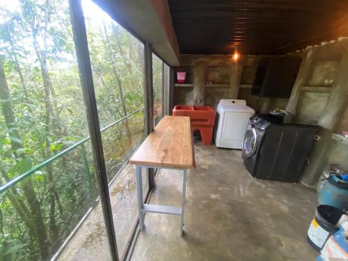 a view of the inside of a tiny house with a table at Sweet Jungle in Quesada