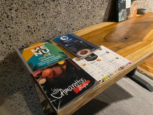 two bags of food sitting on a wooden table at Sweet Jungle in Quesada