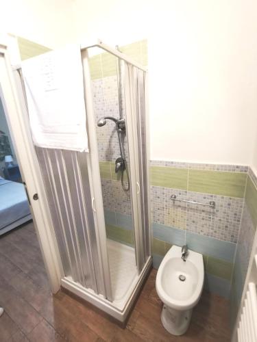 a bathroom with a shower and a toilet at A due passi dal centro Sweet Rooms in Agrigento