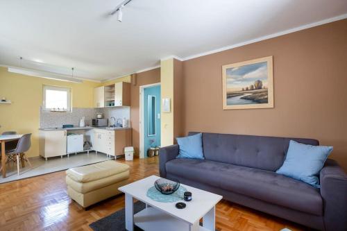 a living room with a couch and a table at Charlie&Blueberries in Belgrade