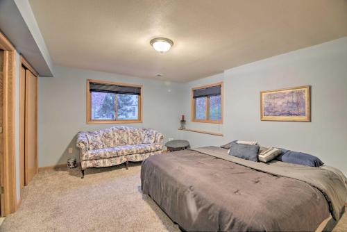 a bedroom with a large bed and a couch at Charming Home with Yard about 12 Mi to Fort Collins in Loveland