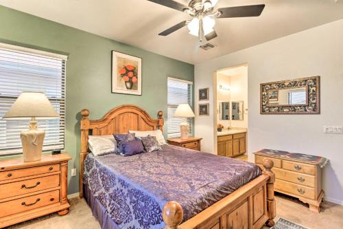 a bedroom with a bed and a ceiling fan at Sahuarita Retreat with Grill about 24 Mi to Tucson! in Green Valley