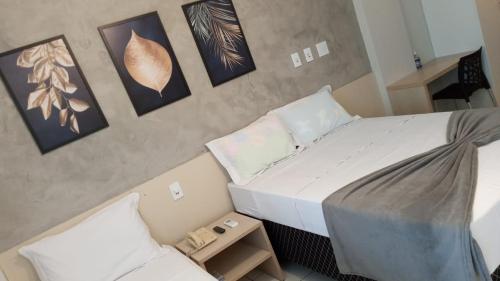 En eller flere senge i et værelse på Gran Lençóis Flat Residence