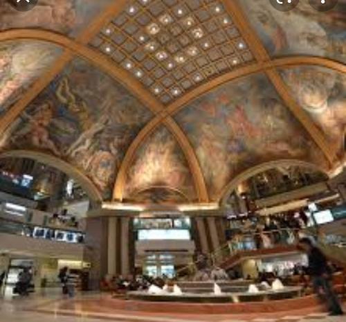 a building with a painting on the ceiling at Florida garden in Buenos Aires