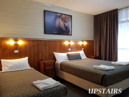 Ένα ή περισσότερα κρεβάτια σε δωμάτιο στο Central Motel Mildura