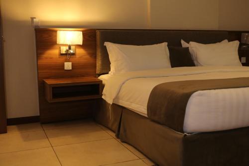 Posteľ alebo postele v izbe v ubytovaní المهيدب للوحدات السكنيه - البوادي