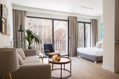 Posteľ alebo postele v izbe v ubytovaní Puerta Catedral Suites