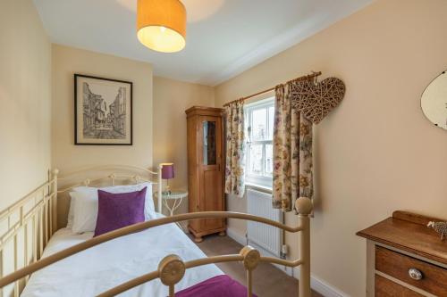 Postel nebo postele na pokoji v ubytování Chapel Cottage