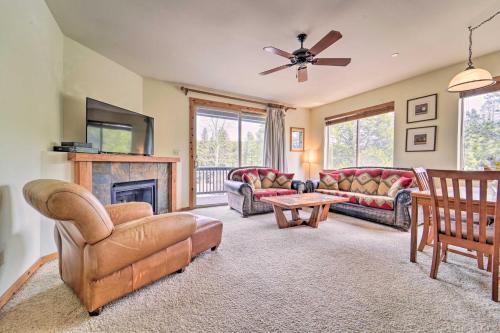 a living room with couches and a fireplace at 2 Mi to Donner Lake Walkable Truckee Condo! in Truckee