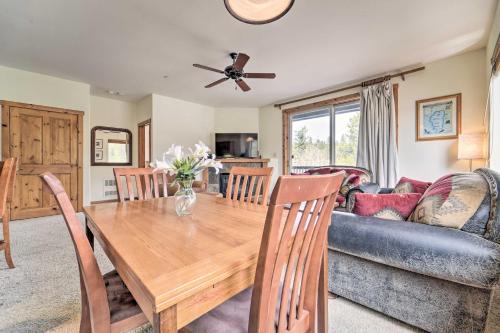 a dining room with a table and a couch at 2 Mi to Donner Lake Walkable Truckee Condo! in Truckee